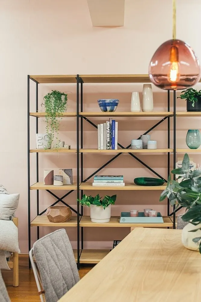Styled open shelving with plants and warm neutral home decor